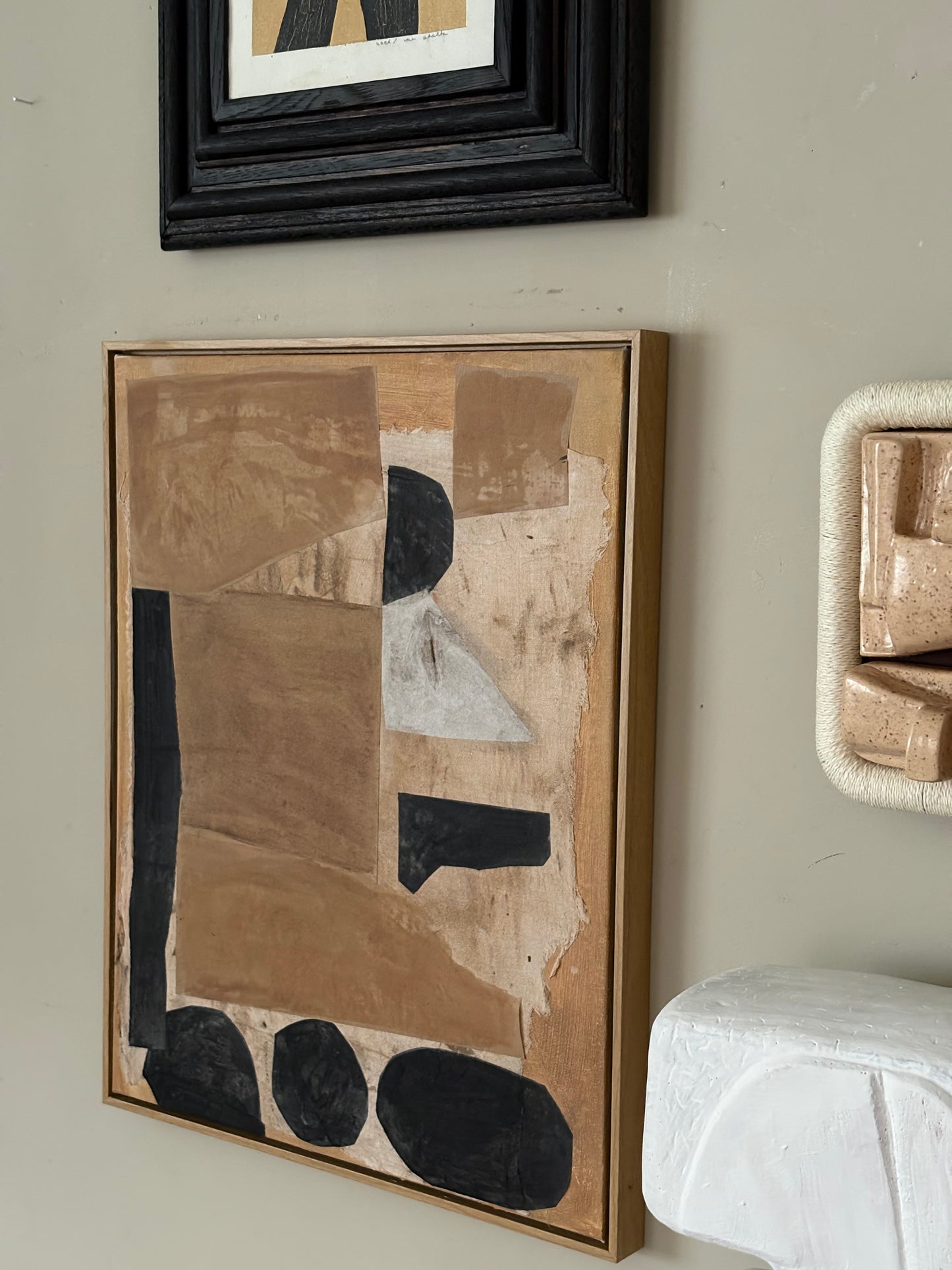 Contained in handmade frame (top)